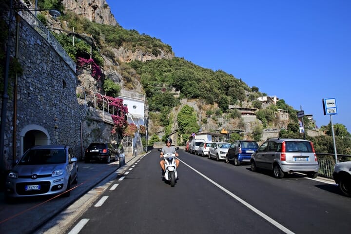 Driving a scooter in the Amalfi Coast in Italy