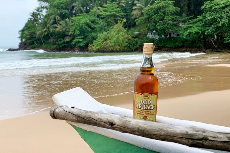 Bottle of arrack on the beach in Sri Lanka