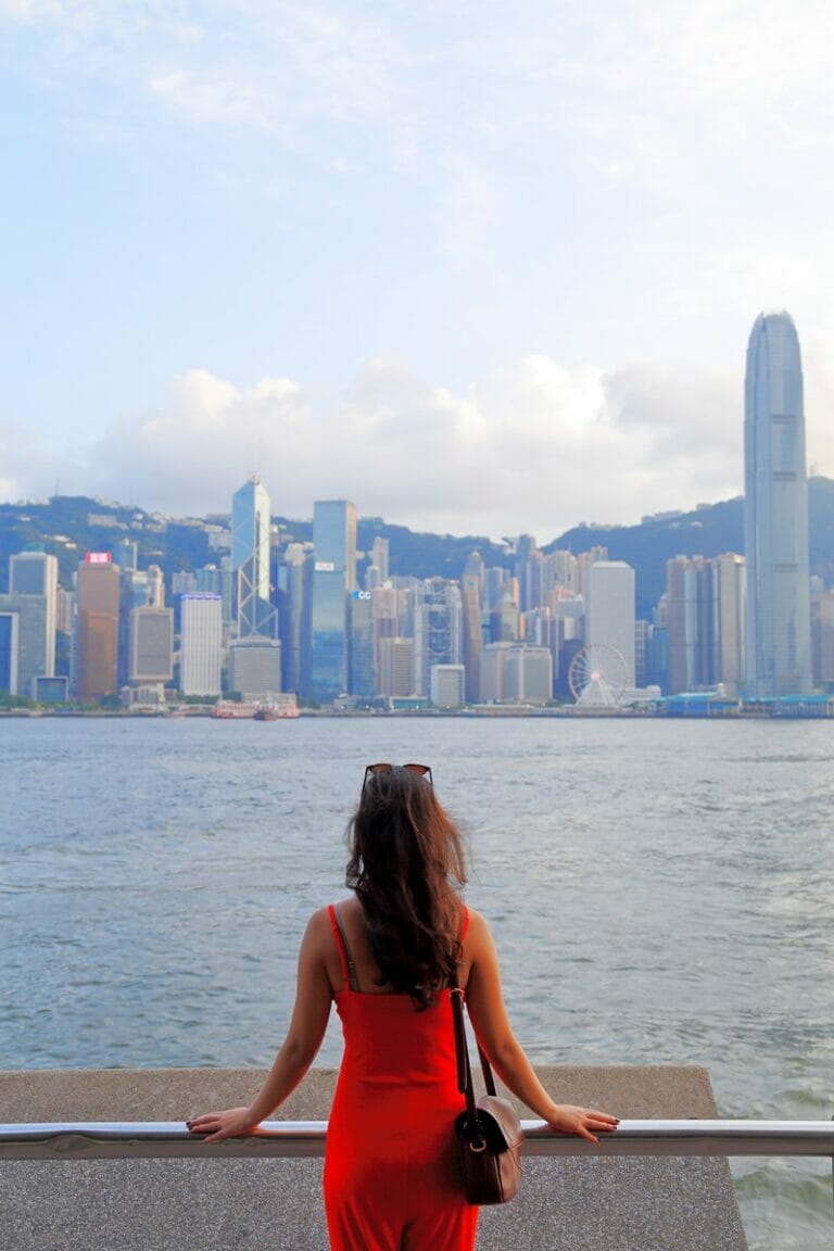 Standing in front of Victoria Harbour in Hong Kong