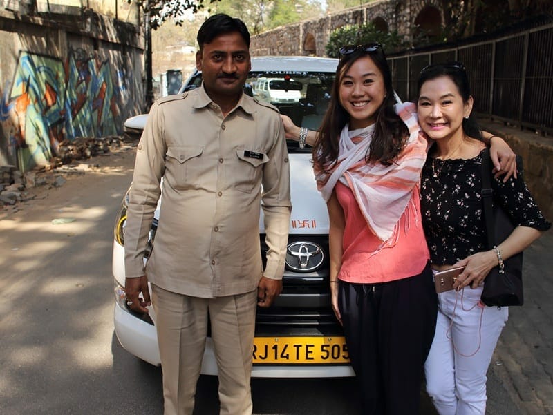 Driver and tour group in India