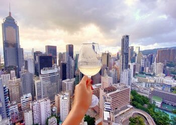 Woman holding wine glass in Hong Kong