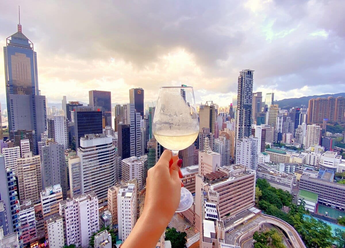 Woman holding wine glass in Hong Kong