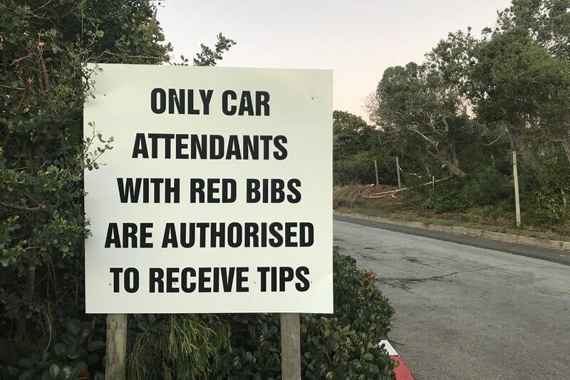 Parking attendant tips sign in South Africa