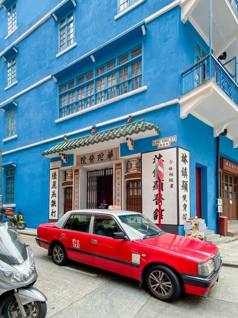 Taxi in front of the Blue House in Wan Chai Hong Kong