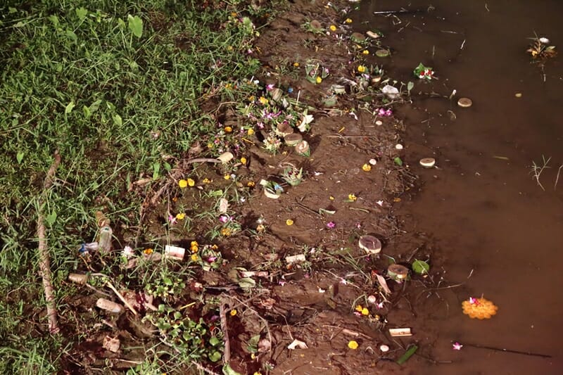Krathongs washing up on river bed in Chiang Mai