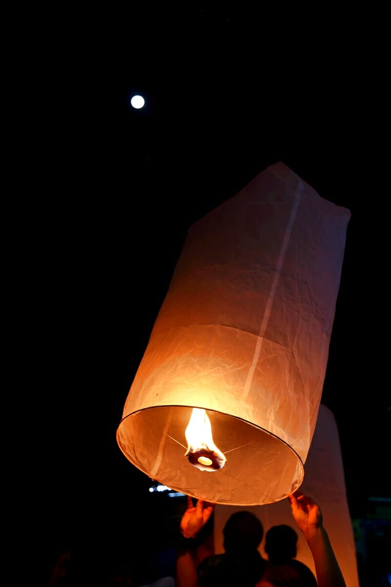 Yi Peng Lantern Festival in Chiang Mai Thailand releasing a lantern