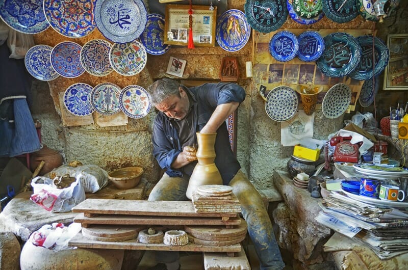 Man working on the potter's wheel, making the bowl with their own hands in Avanos, Cappadocia, Central Anatolia,Turkey