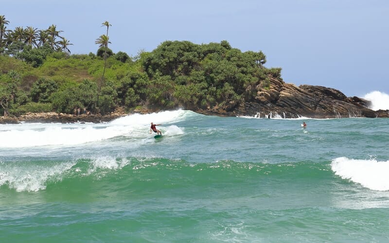 Surfing at Hiriketiya Beach in south Sri Lanka