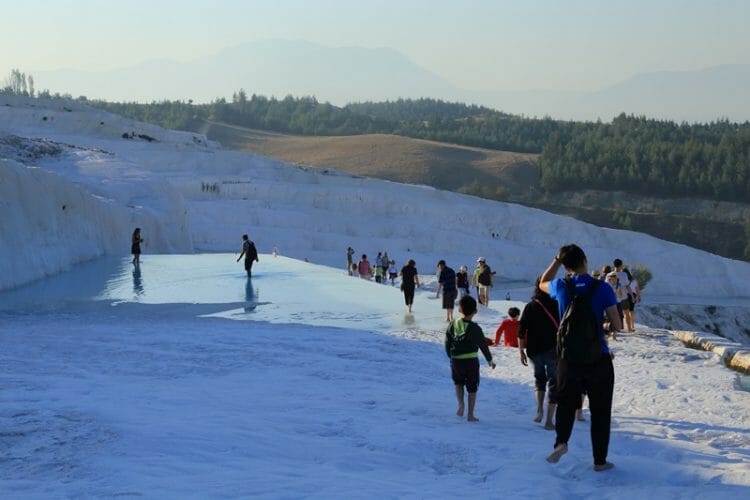 Tourists at Pamukkale Travertines in the morning