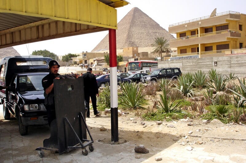 GIZA - APRIL 27: Egyptian security forces guard the entrance to the pyramids at the great pyramids in Giza, Egypt on April 27 2007.Since the 90's tourist became a target by Muslim militant in Egypt