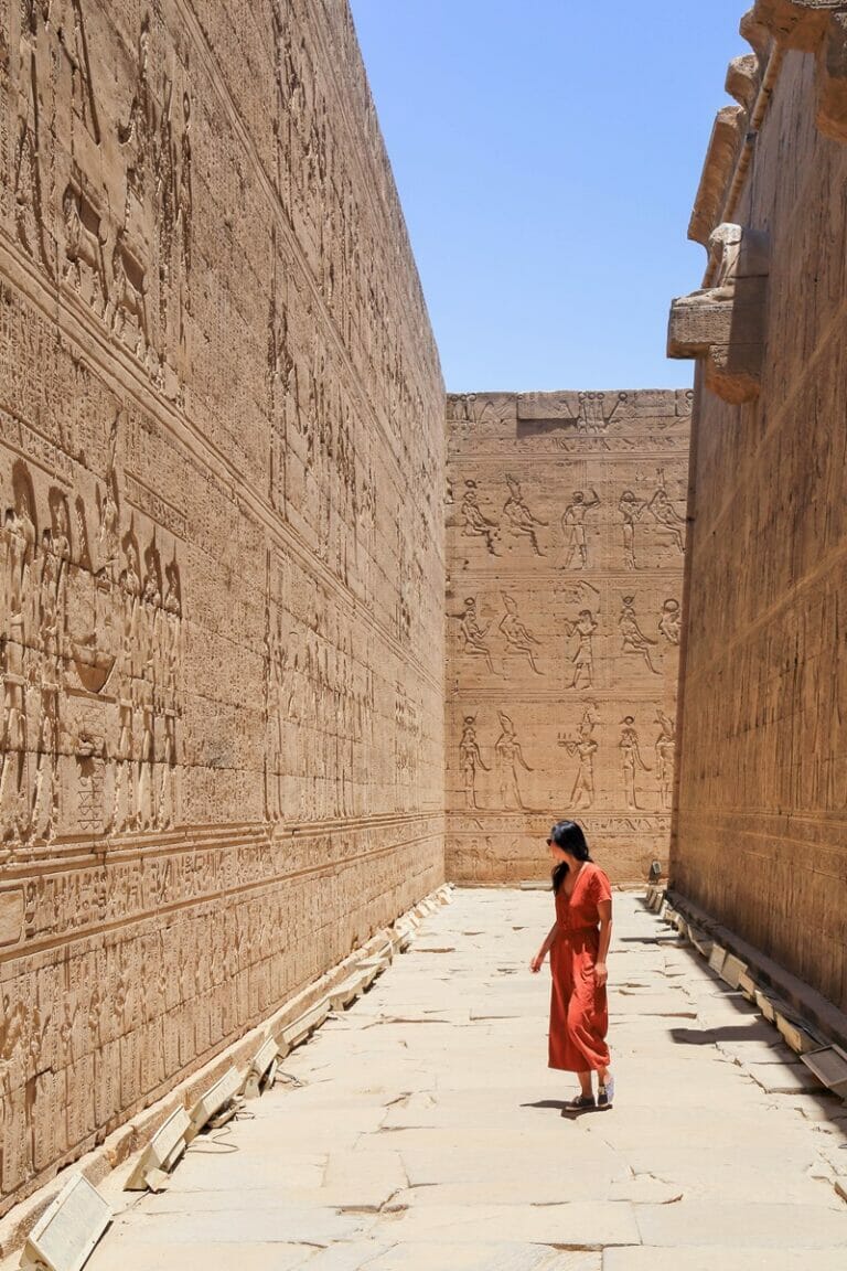 Woman standing in the Temple of Horus in Edfu in Egypt
