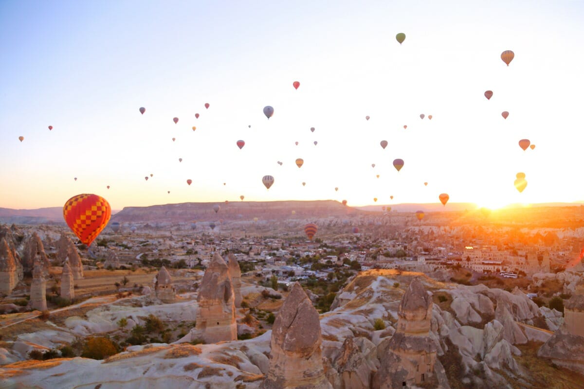 Hot air balloons above fairy chimneys in Cappadocia Turkey