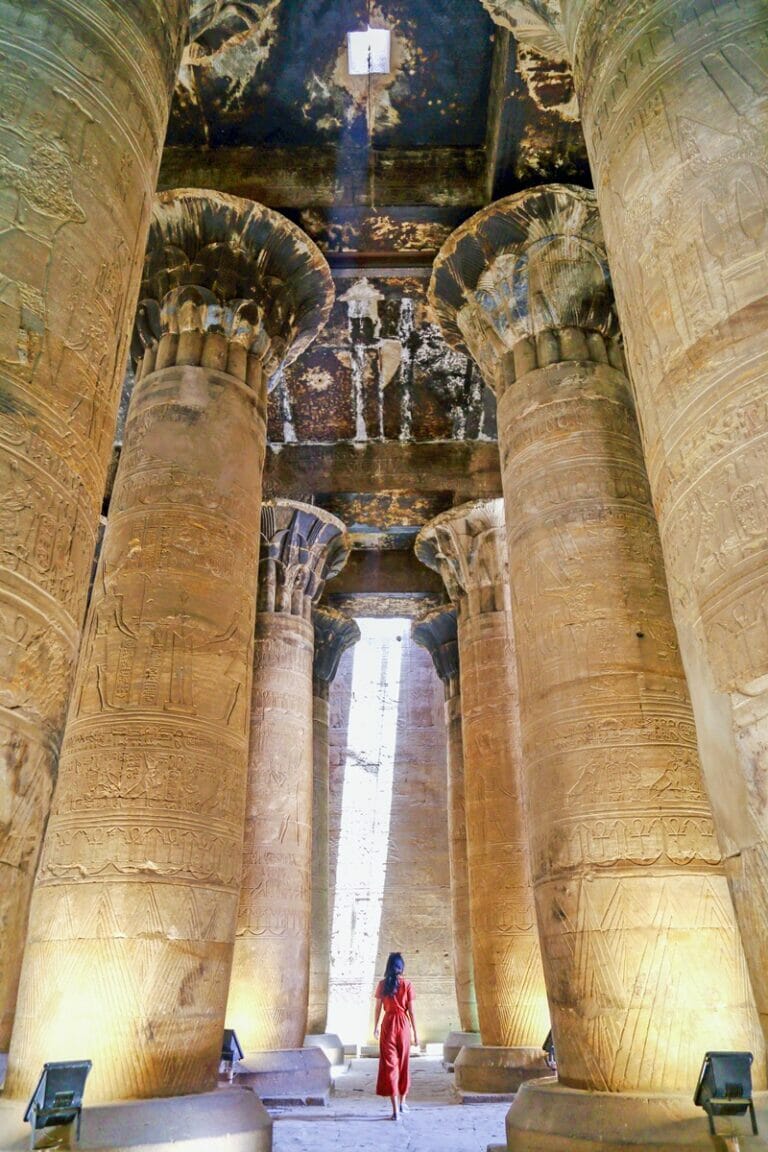 Walking through the columns at the Temple of Horus in Edfu in Egypt