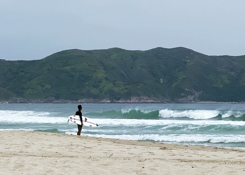 Surfer at Tai Wan Beach in Tai Long Wan Hong Kong