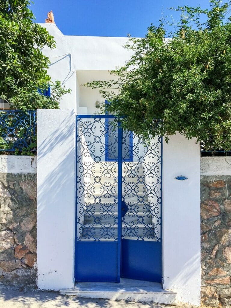 Blue metal gate in Santorini Greece