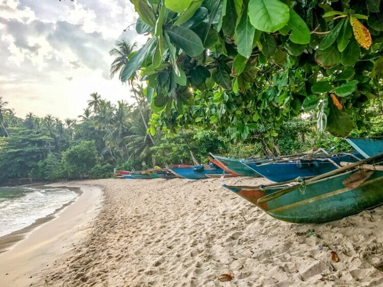 Fishing boats on Hiriketiya beach in Sri Lanka