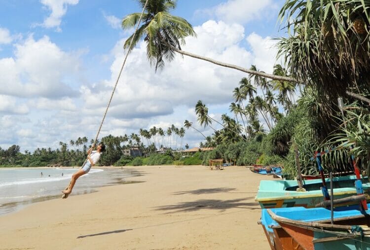 Rope swing on Pehebhiya Beach in Sri Lanka