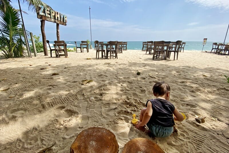 Baby playing in the sand at Zephyr Kamburugamuwa in Sri Lanka