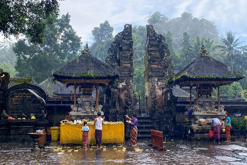Raining at Pura Tirta Empul in Ubud Bali