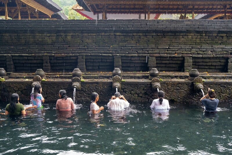 Worshippers at Pura Tirta Empul near Ubud Bali