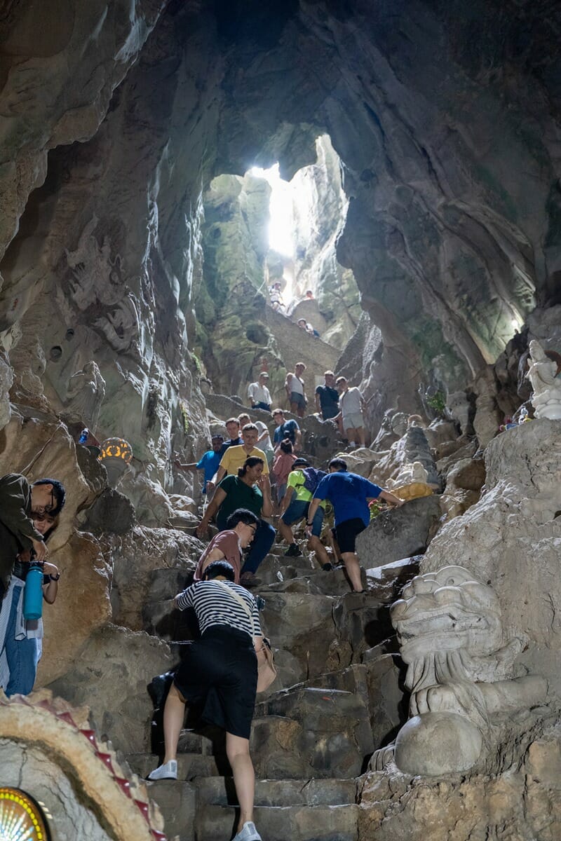 Climbing steps at a cave in the Marble Mountains in Vietnam