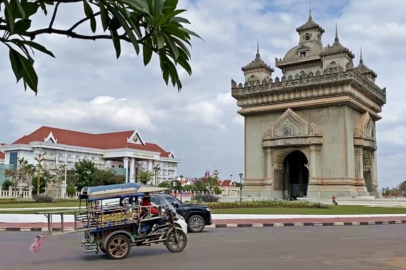 Tuk tuk at Patuxay Monument in Vientiane Laos