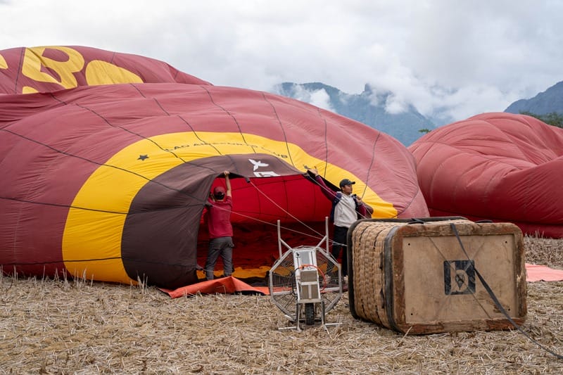 Hot air balloon being inflated by Above Laos in Vang Vieng Laos