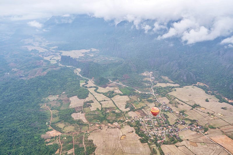 Hot air balloon flying over Phangern Viewpoint in Vang Vieng Laos