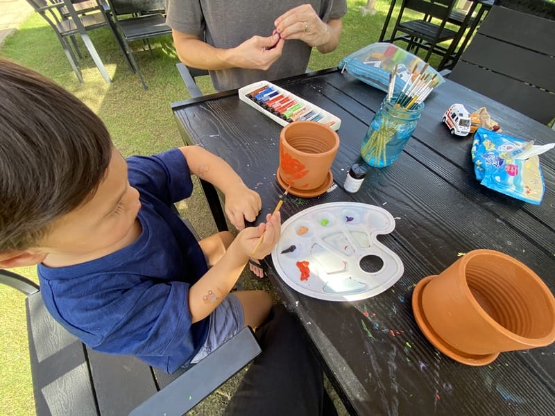 Painting flower pots at Marasca Khao Yai in Thailand