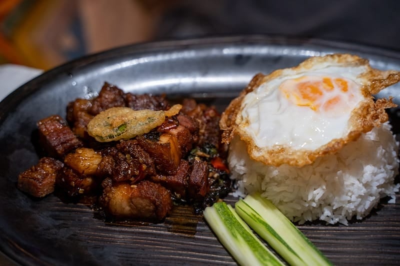 Crispy pork belly krapao at The Slate Phuket in Thailand