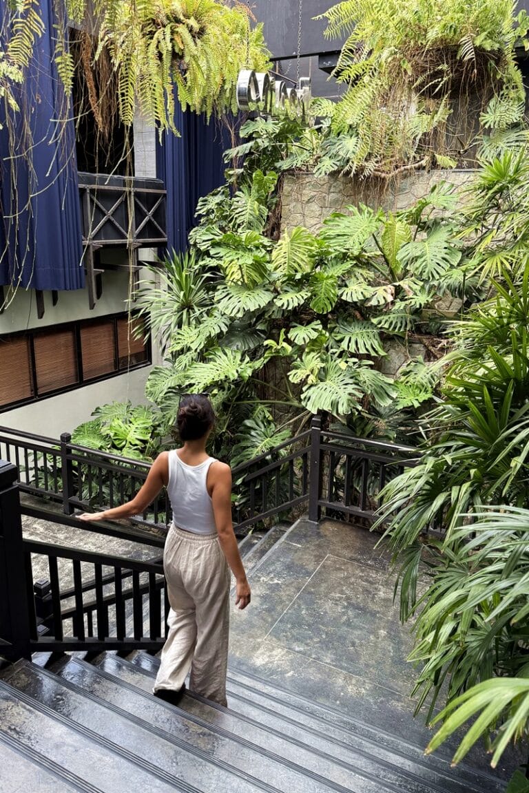 Walking down the stairs at The Slate Phuket in Thailand