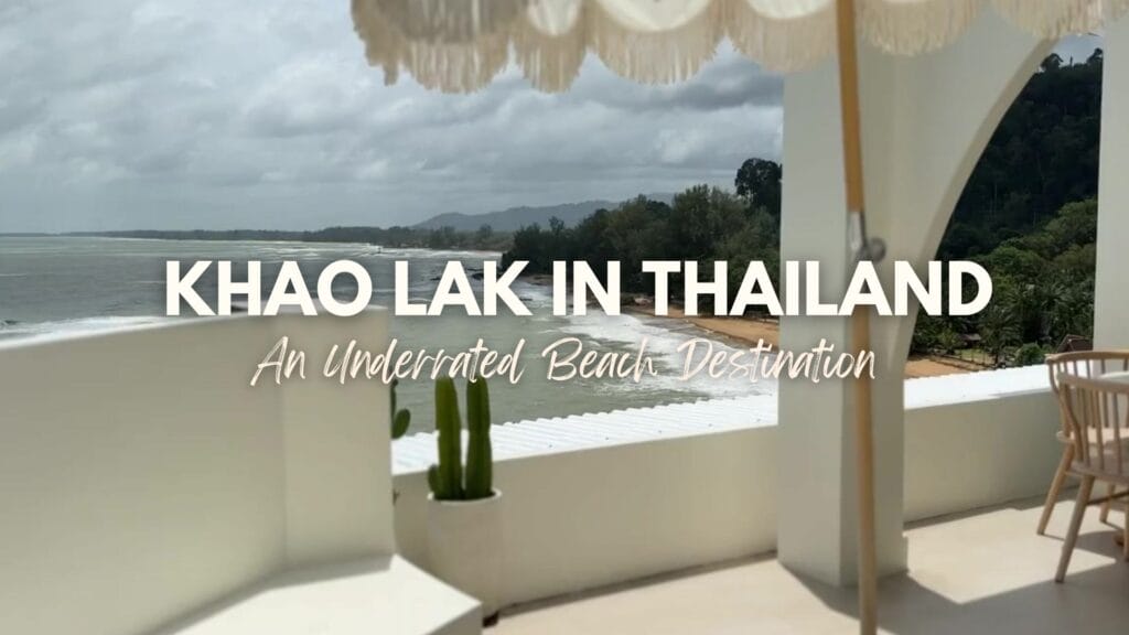 Umbrella and beach view of Khao Lak in Thailand with text overlay