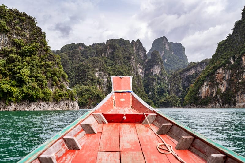 Longtail boat on Cheow Lan Lake in Khao Sok National Park in Thailand