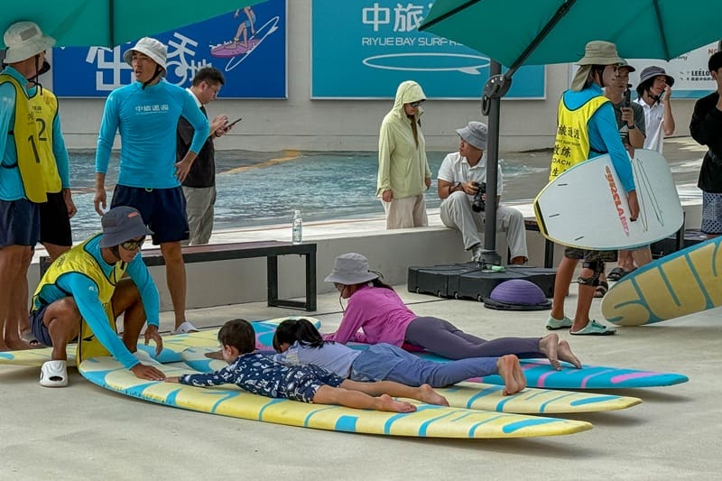 Child surf lesson at wave pool in Hainan China